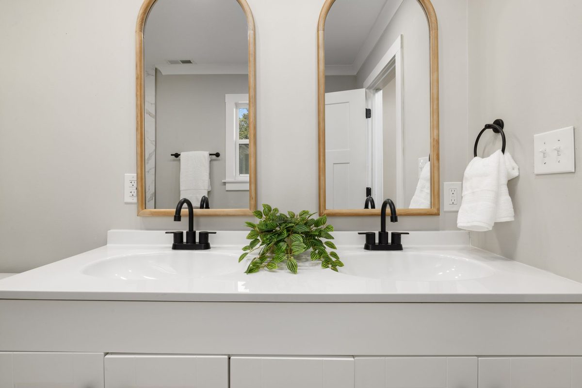 Vanity unit with two basins and black taps